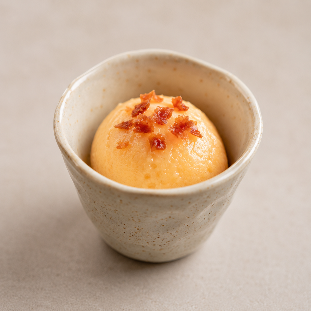 Cantaloupe sorbetto topped with crispy prosciutto