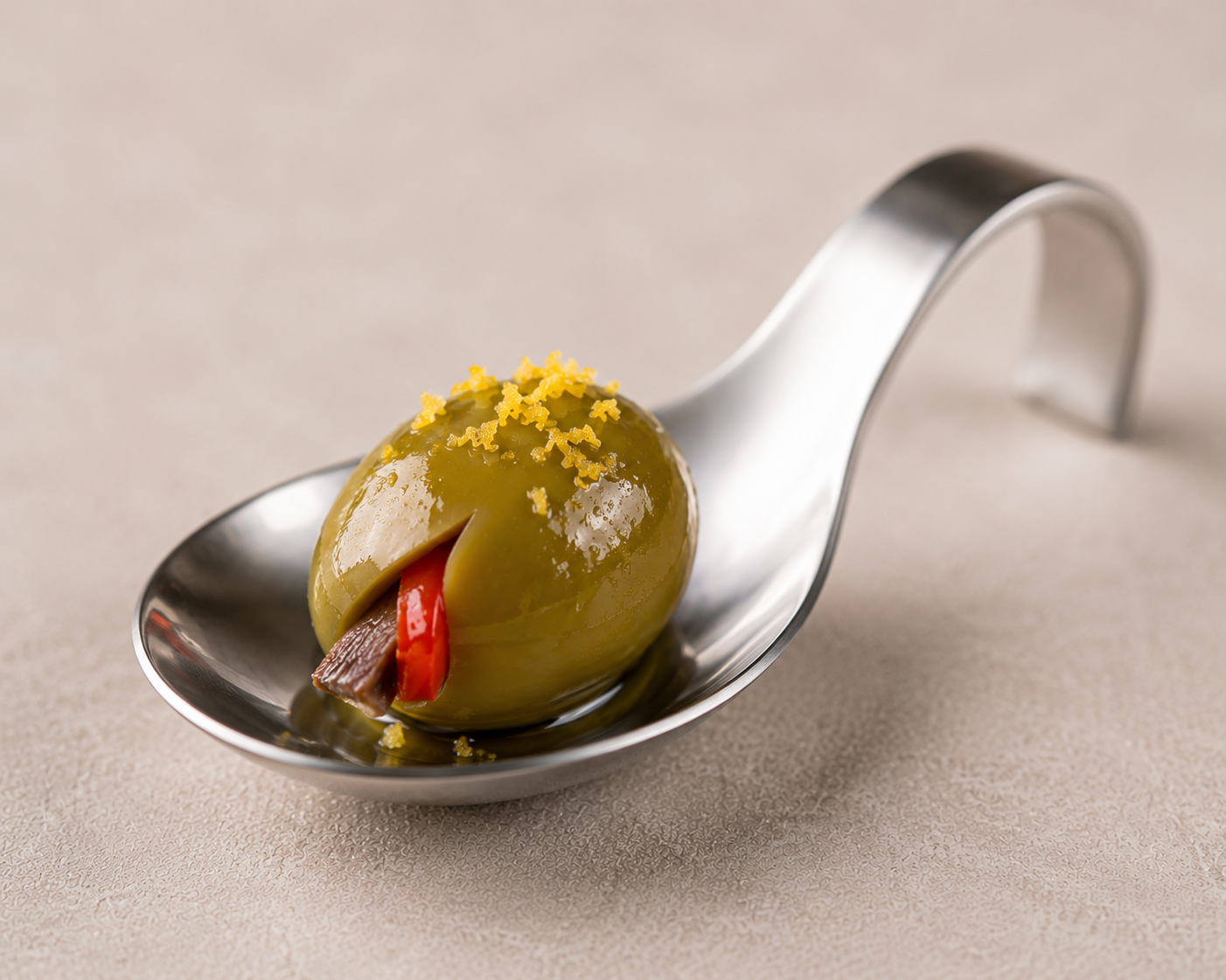 Italian olive filled with anchovy and red pepper served as an aperitivo bite